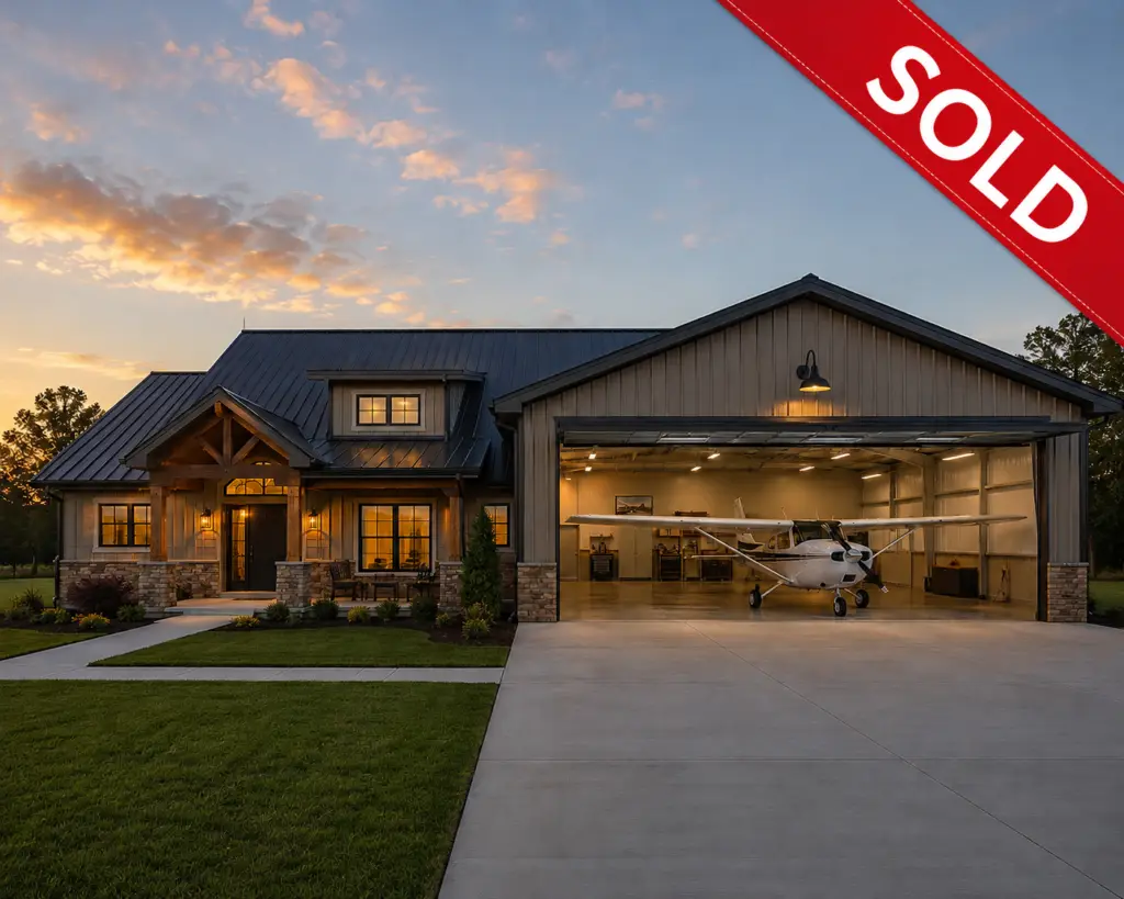 Rustic farmhouse with hangar at sunsetSelectAspect ratioShare